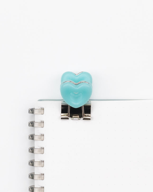 VELOS Heart Shape Clip on a notebook